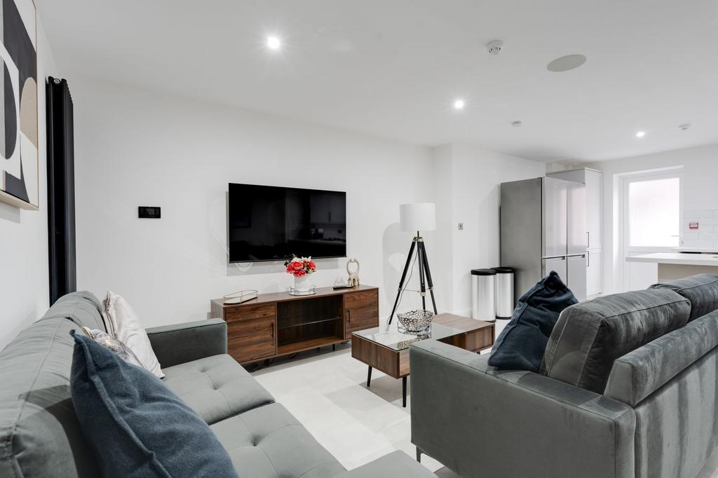 Bright and contemporary living room featuring c...