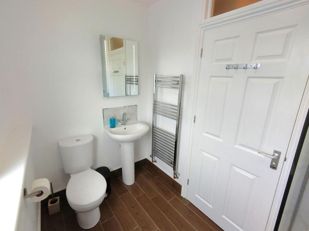Bright, modern bathroom with white sanitaryware...