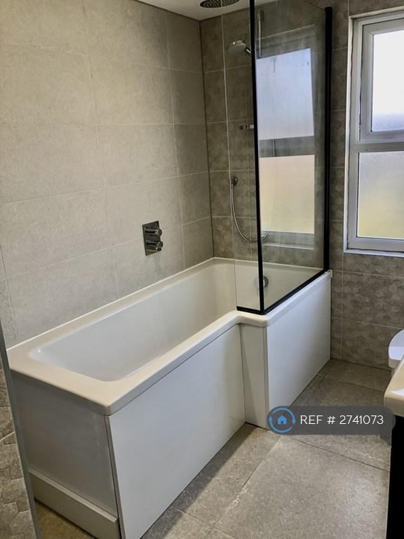 En Suite Bathroom With Shower Over Bath