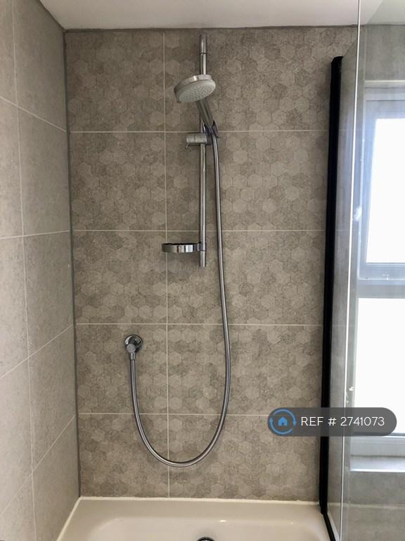 En Suite Bathroom With Shower Over Bath