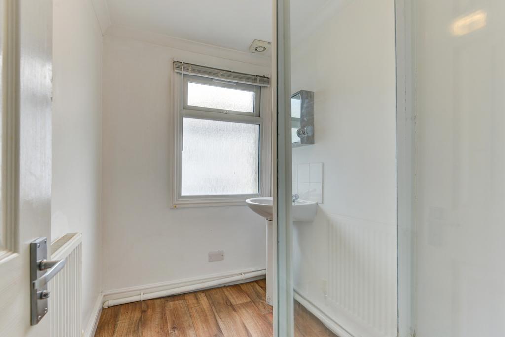 A clean, well-maintained bathroom with a window...