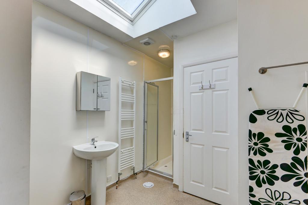Bright and clean bathroom with a sink and ample...