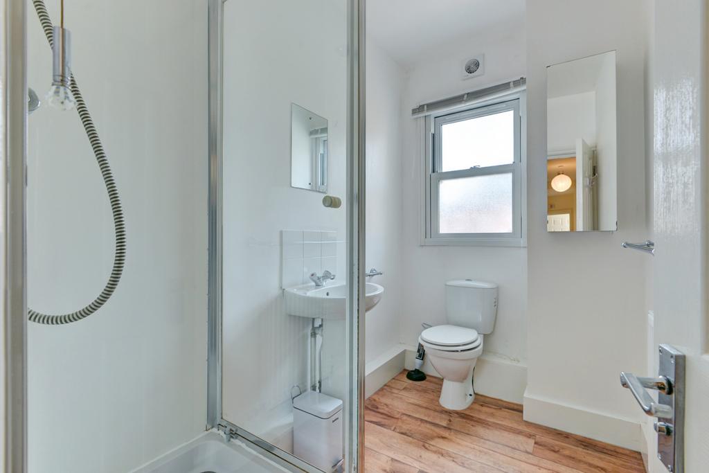 Bright, modern bathroom with a walk-in shower, ...