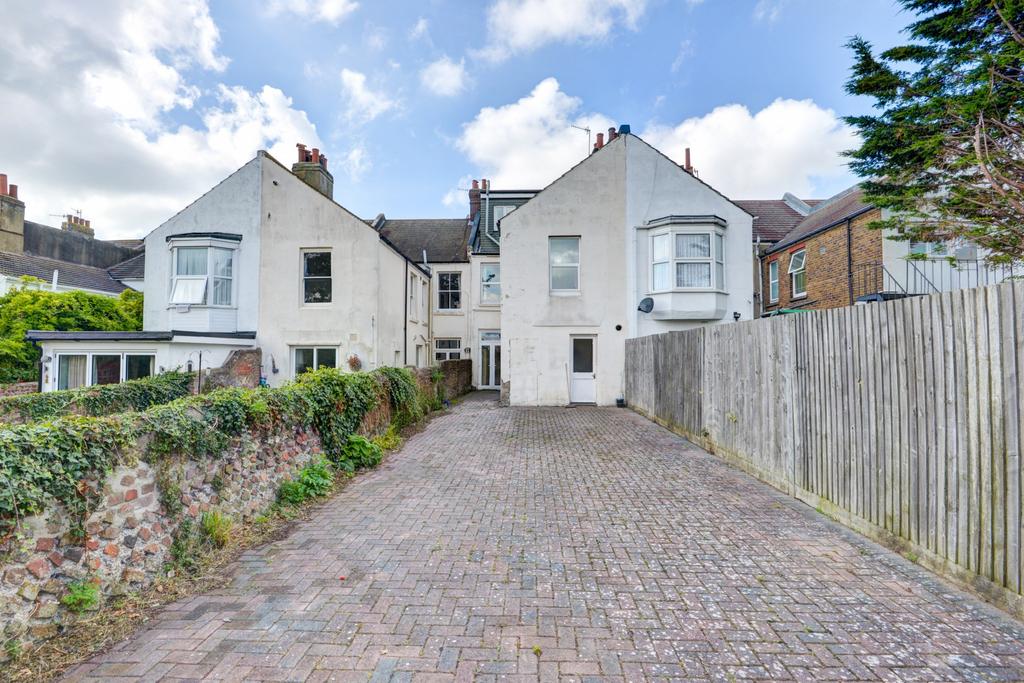 A welcoming view of the front of a charming res...