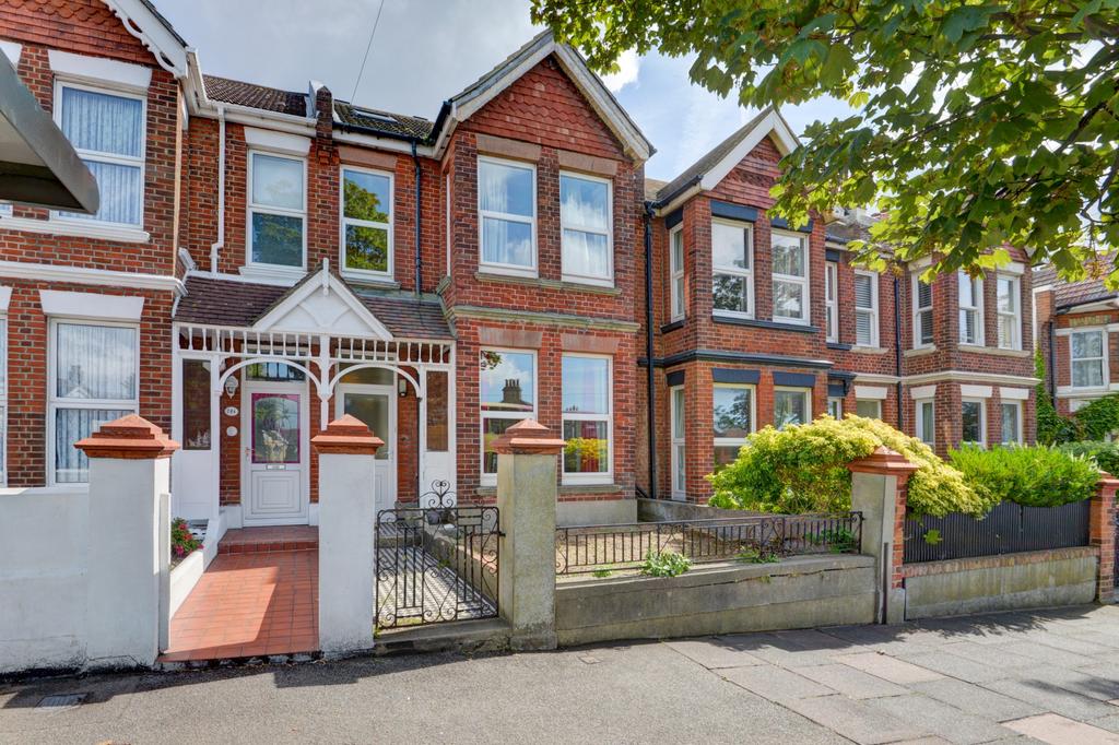 A charming Victorian-style front facade of a re...