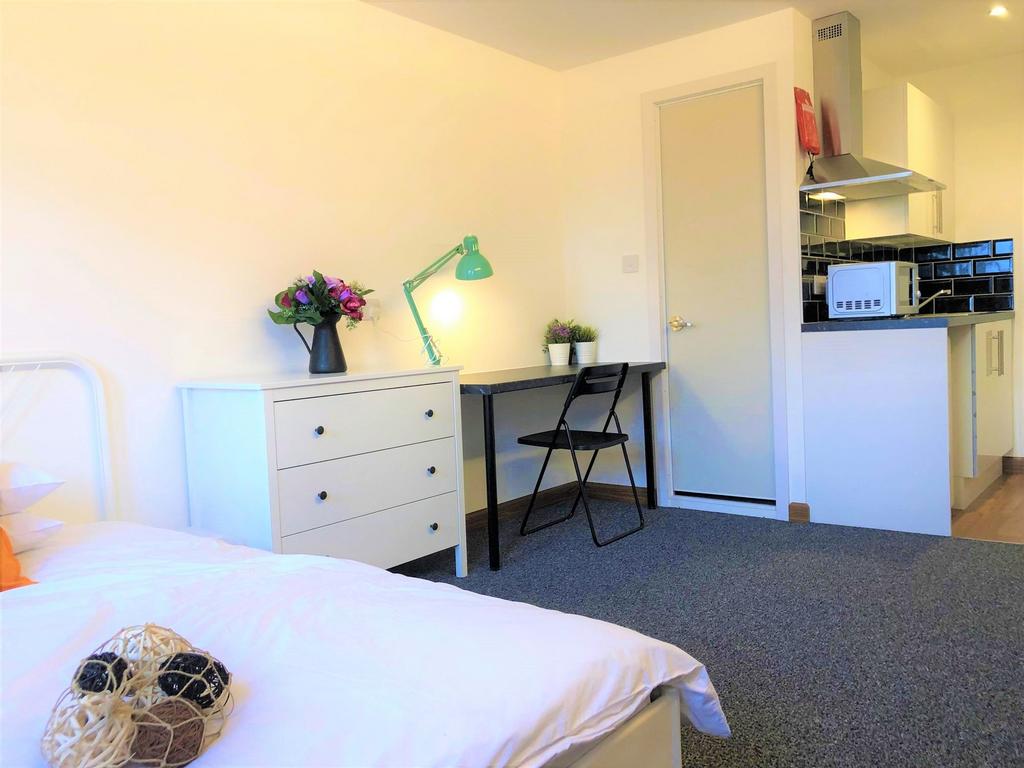 Bright single bedroom featuring a tidy study ar...