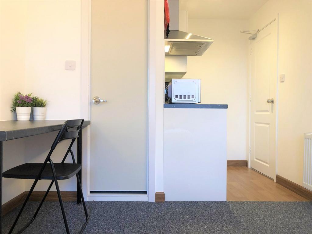 A bright and tidy communal workspace featuring ...