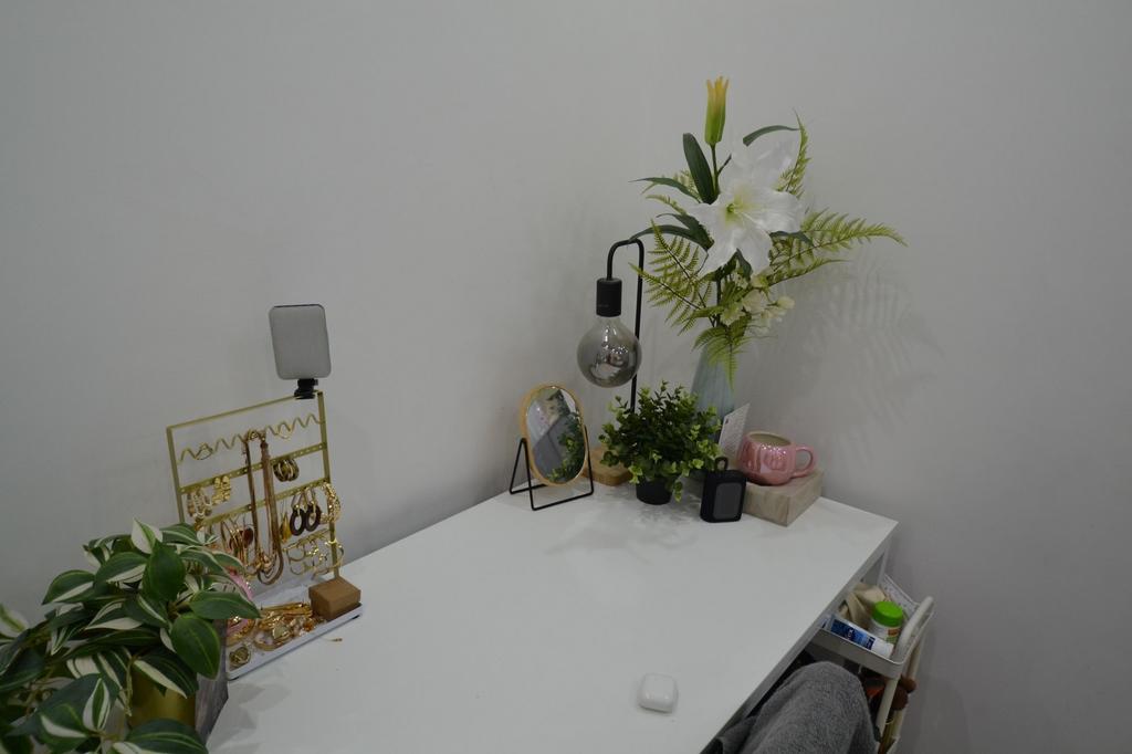 Bright, tidy white desk styled with decorative ...