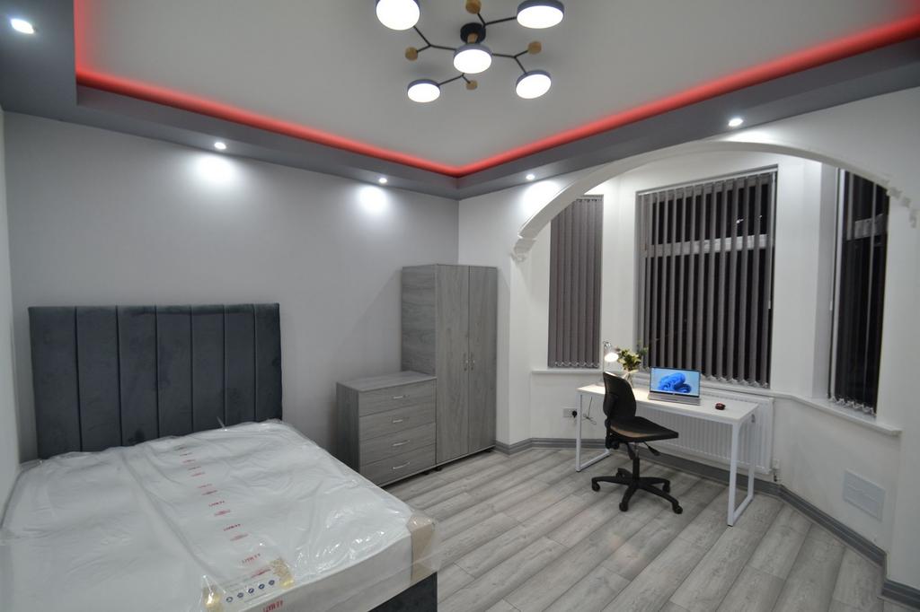 Modern bedroom featuring a comfortable double b...