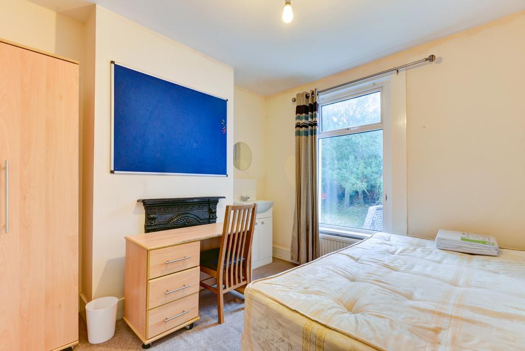 Bright, neatly presented bedroom with a comfort...