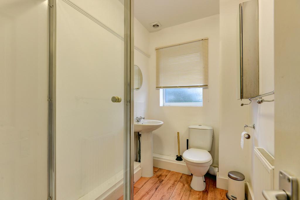 Bright, well-maintained bathroom with a walk-in...