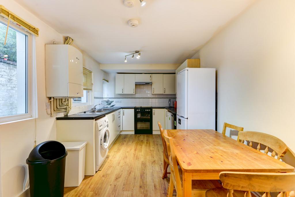 A bright and well-maintained kitchen area featu...