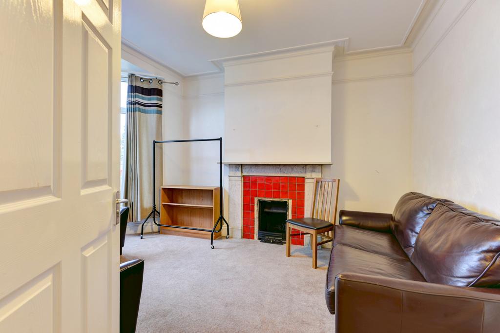 A cozy living room featuring a comfy leather so...
