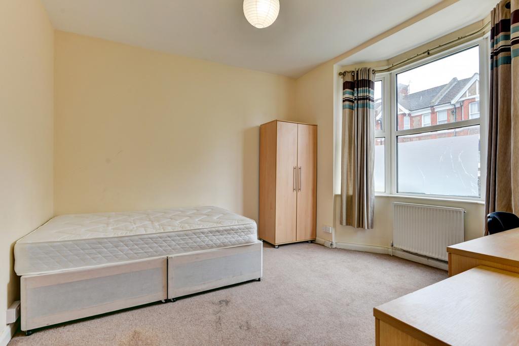 Bright, neatly presented bedroom with a double ...