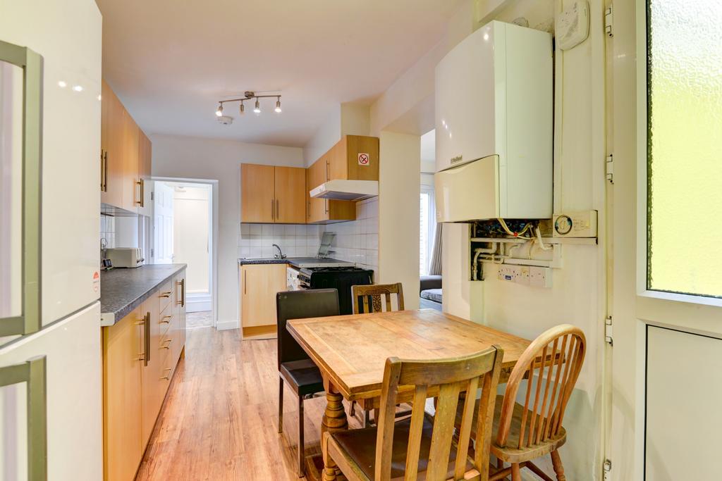 Bright, well-maintained galley kitchen with mod...