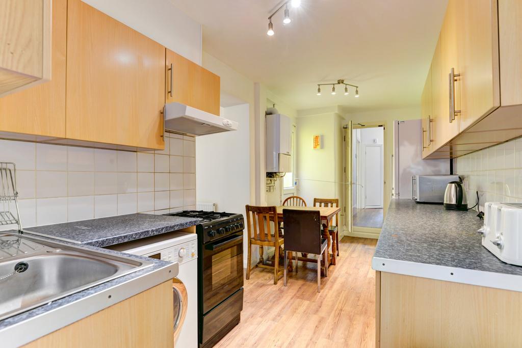 Bright, modern galley kitchen with wood-effect ...