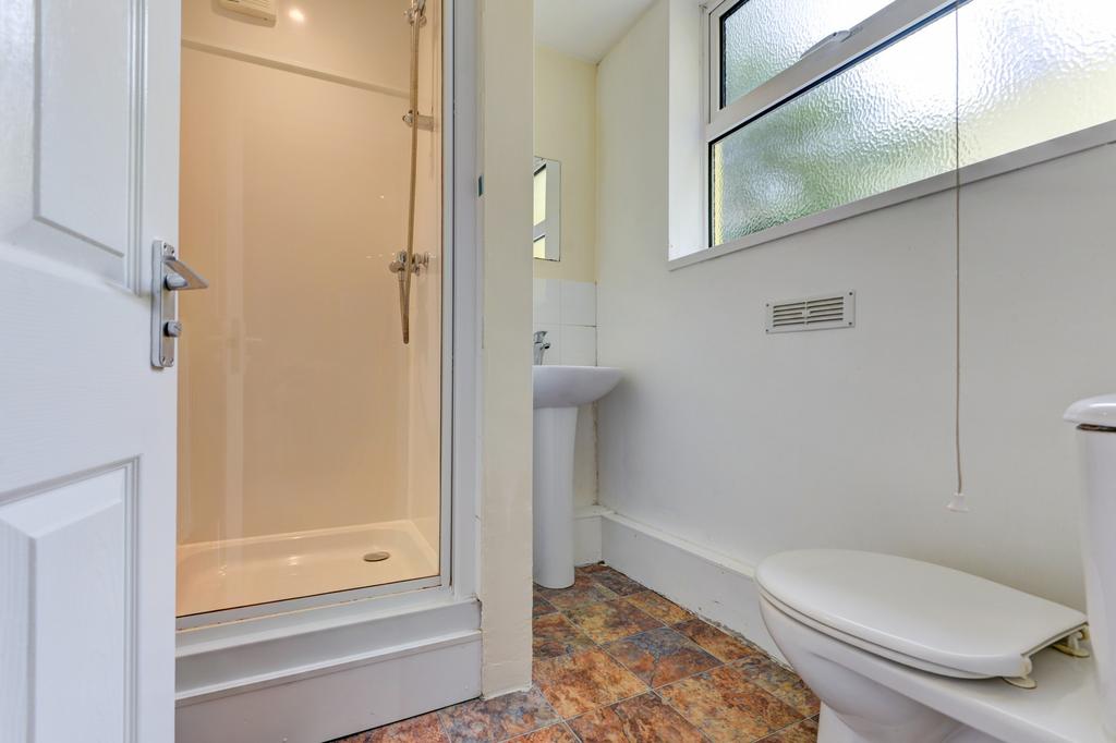 Bright, modern bathroom with a walk-in shower, ...