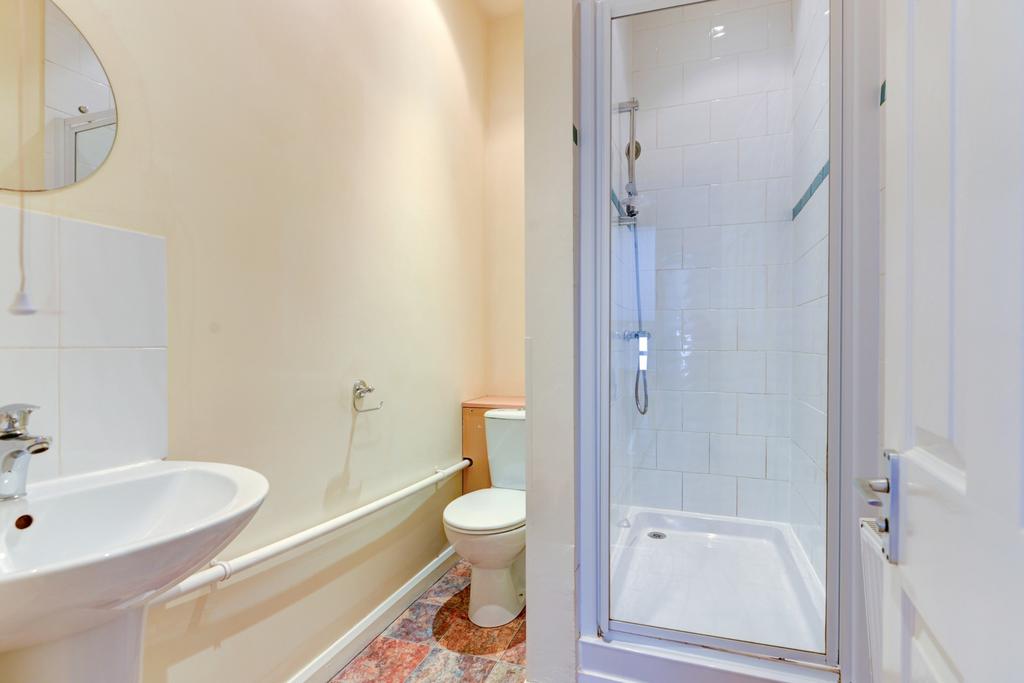 Bright, well-maintained bathroom with a walk-in...