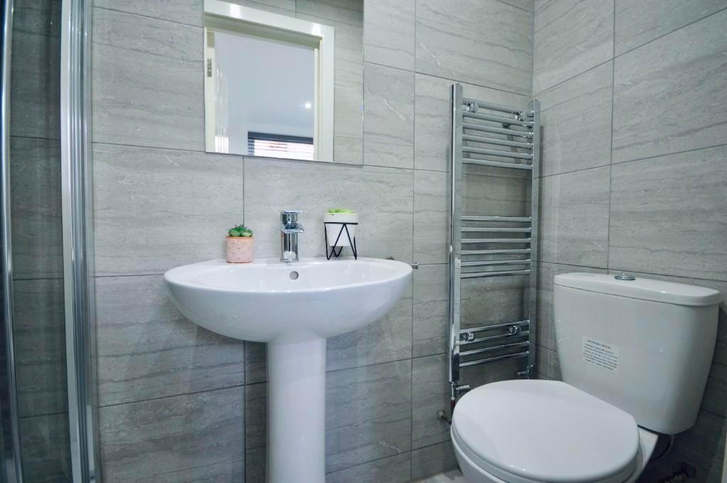A clean and well-maintained bathroom featuring ...