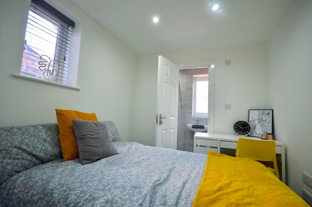 A spacious and well-maintained master bedroom f...