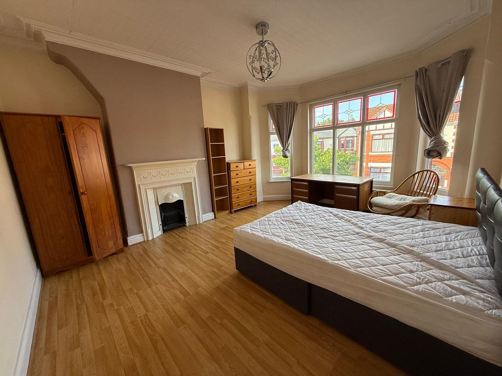 Bright, spacious bedroom with large bay windows...