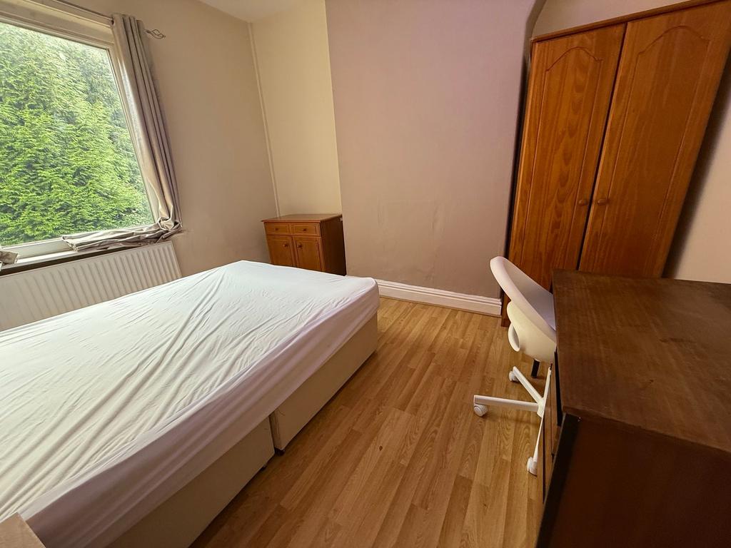 Bright, neatly presented bedroom with a double ...