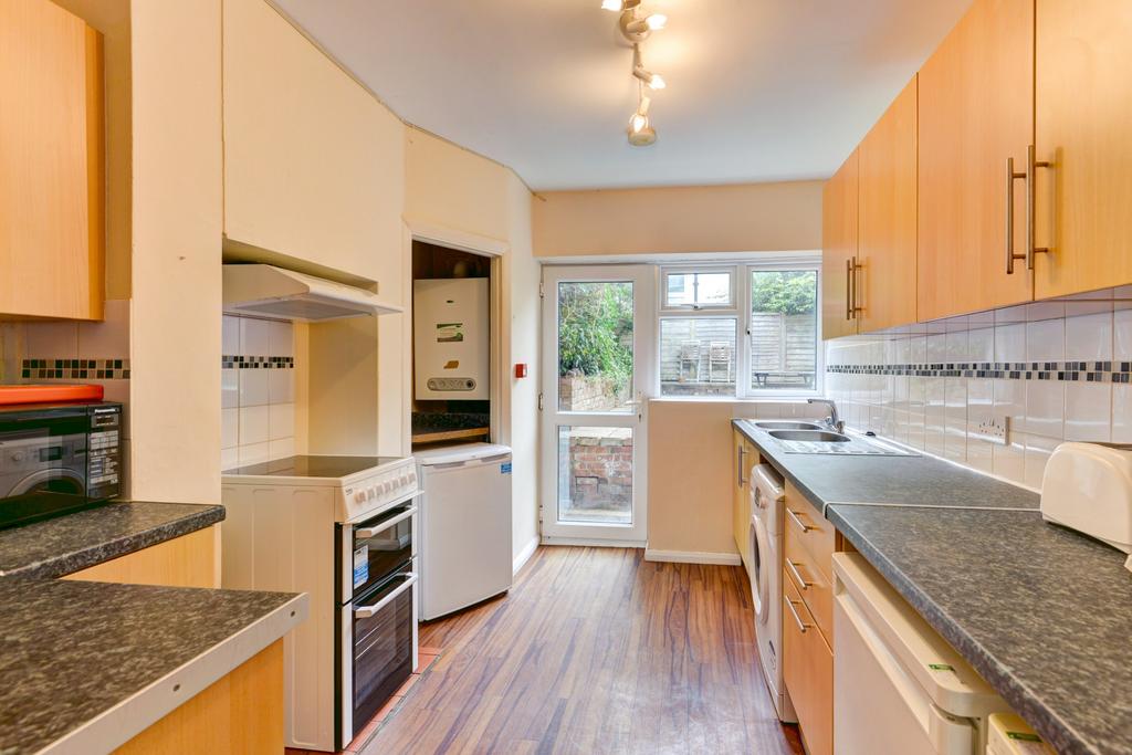 Bright and well-maintained kitchen featuring am...
