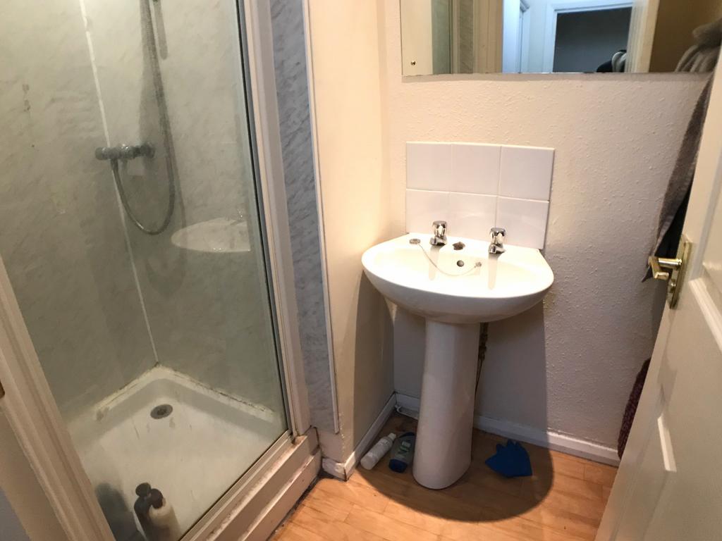 A clean and well-maintained bathroom featuring ...