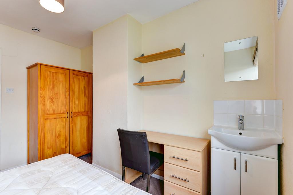 Bright, neatly presented bedroom with a double ...