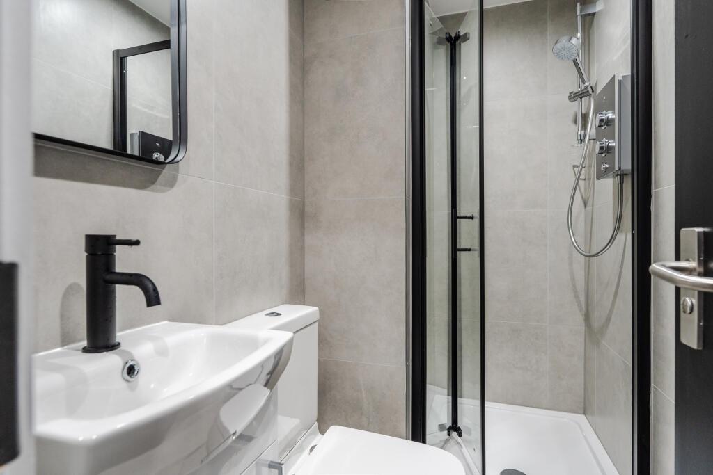 A modern, well-maintained bathroom featuring a ...