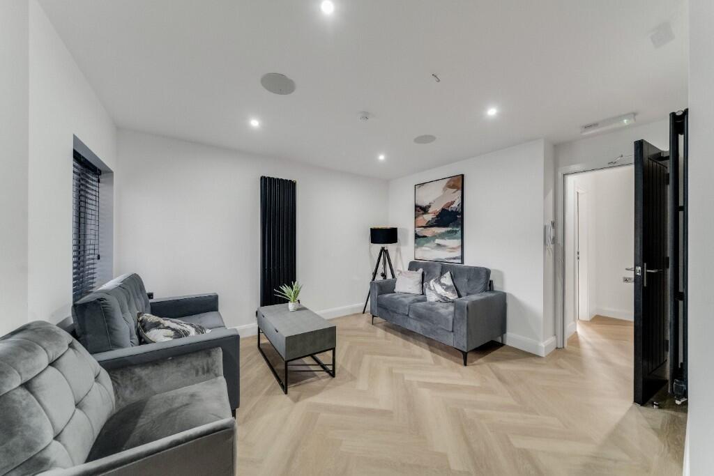 A modern, well-lit living room with stylish fur...