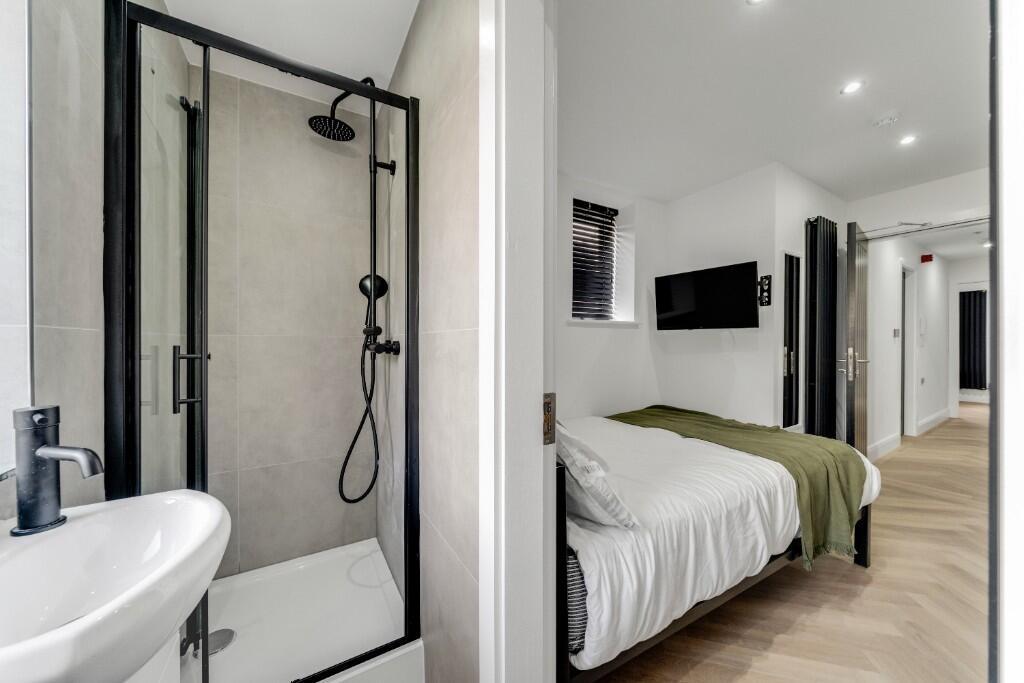 Modern, well-maintained bathroom featuring a sp...