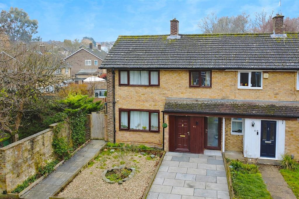 Semi-detached houses in a suburban setting.png