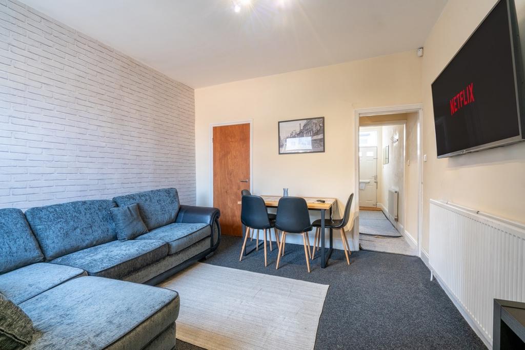 Bright, modern living room with a comfortable L...