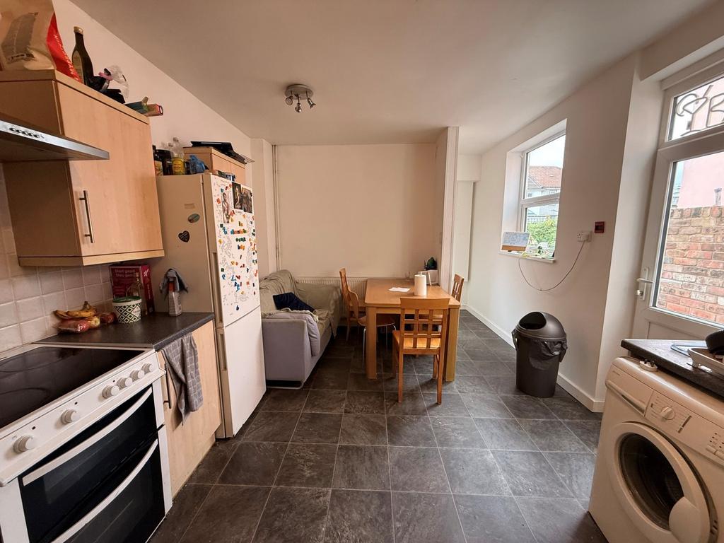 Bright open-plan kitchen/dining area with a fit...