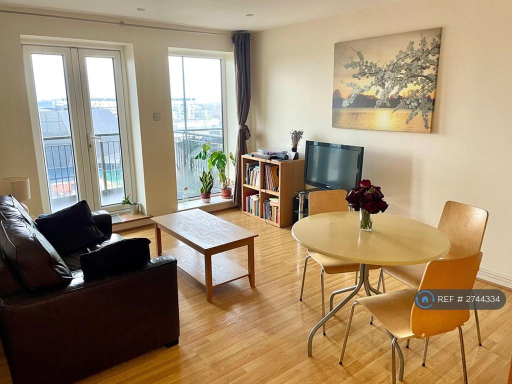 Spacious Living Room Leading To a Private Balcony