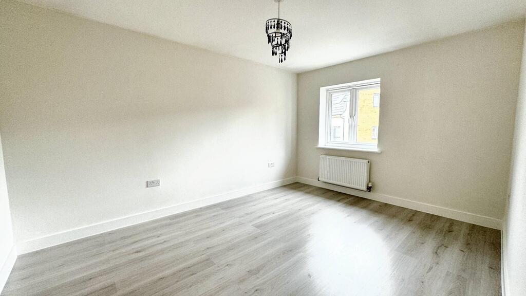 Bright, freshly painted bedroom with new lamina...