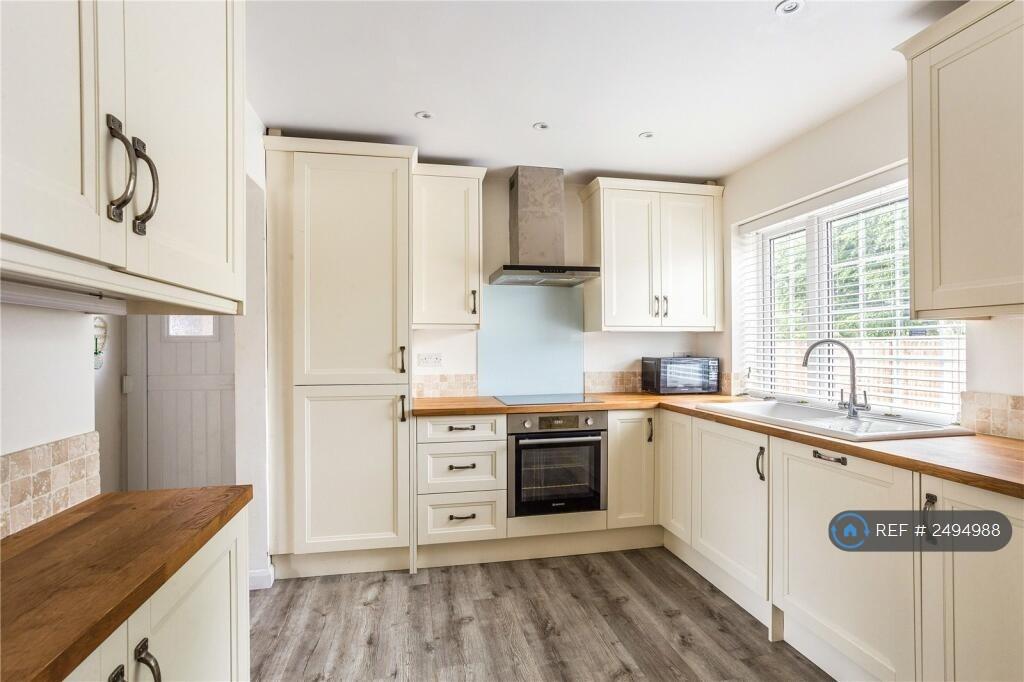 Kitchen With Wooden Surfaces And Int. Appliances