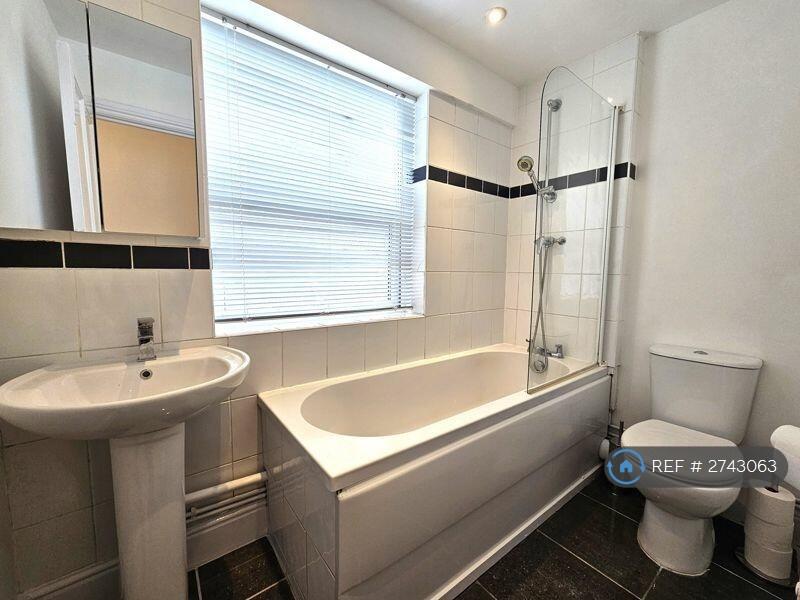 Bathroom With Shower And Bath And Radiator