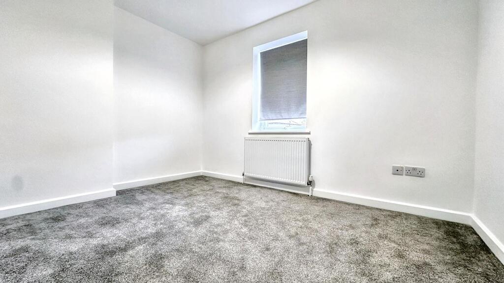 Bright, freshly decorated bedroom with neutral ...