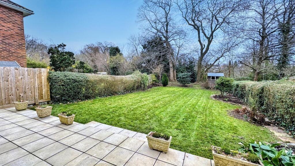 Well-maintained rear garden with a paved patio ...