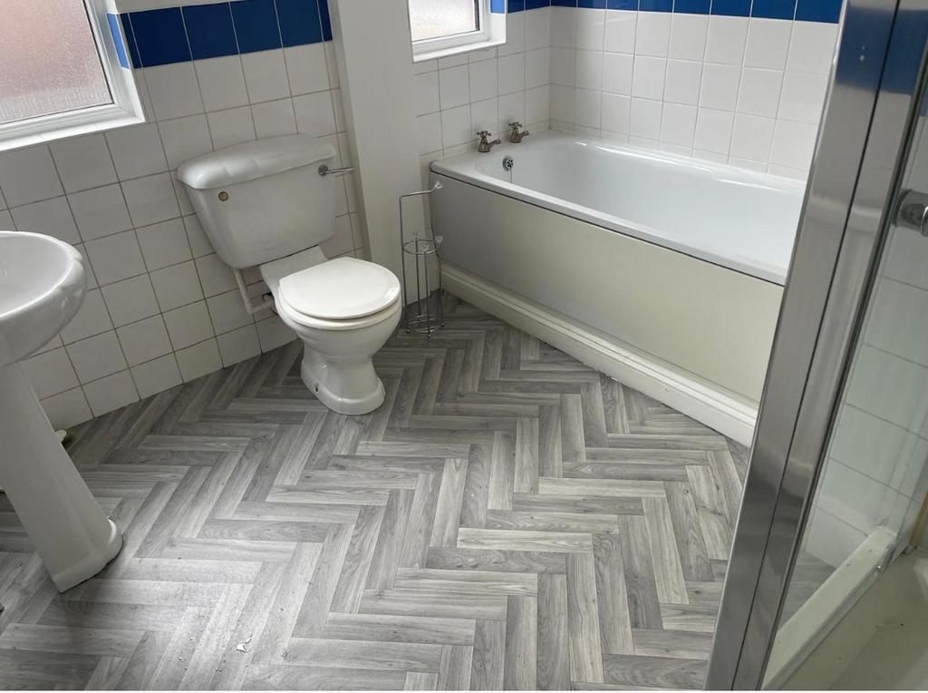 Clean and well-maintained bathroom with a batht...