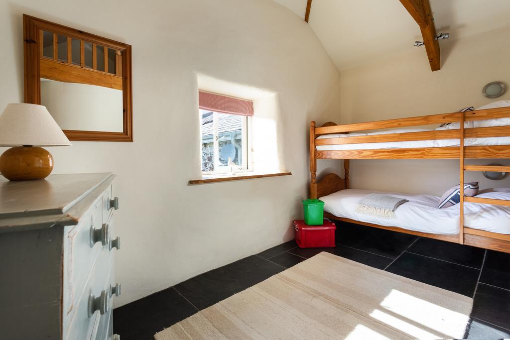 The second bedroom is arranged with bunk beds and