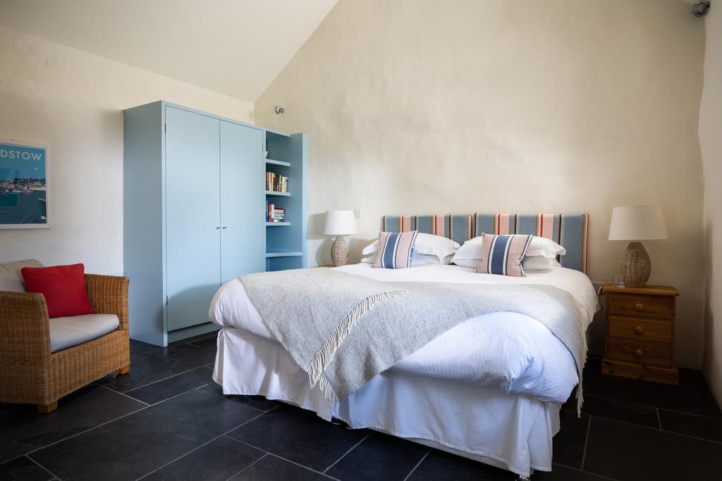 The main bedroom is spacious with high ceilings