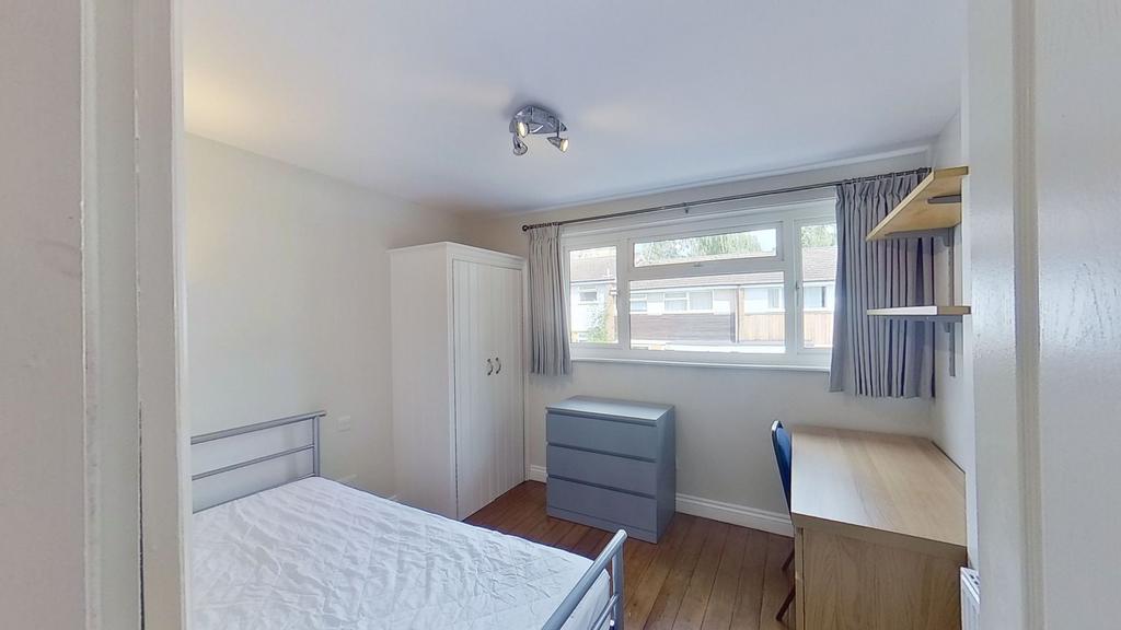 Bright, tidy double bedroom with a metal bed fr...