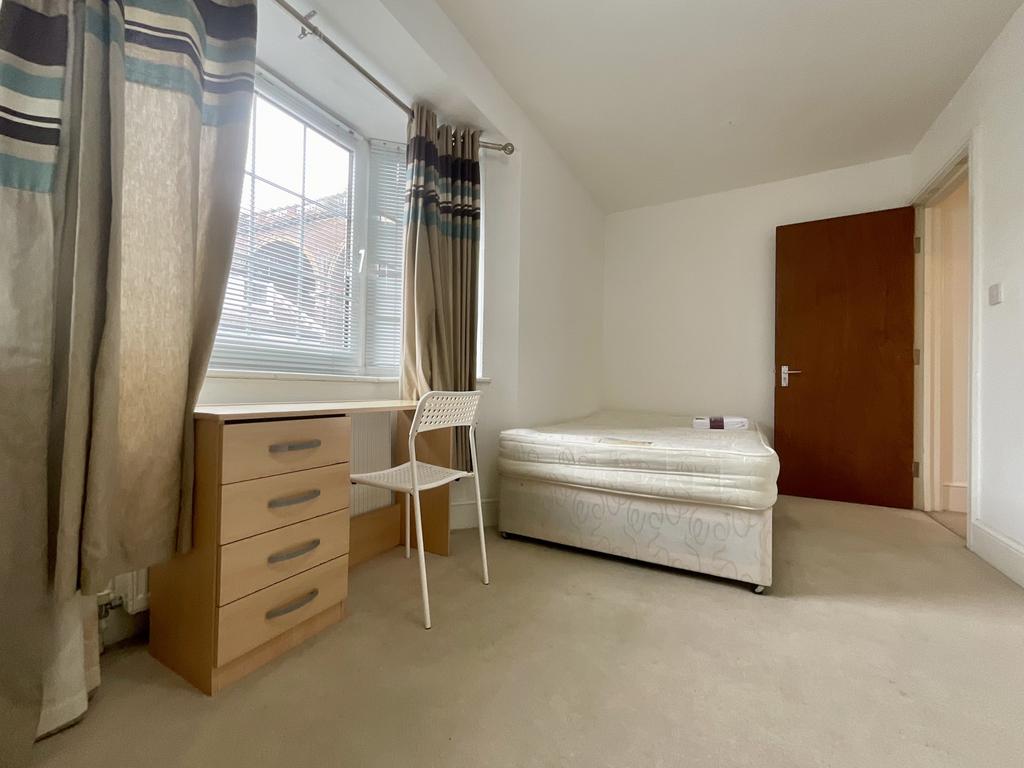 A clean and simple bathroom featuring a toilet ...