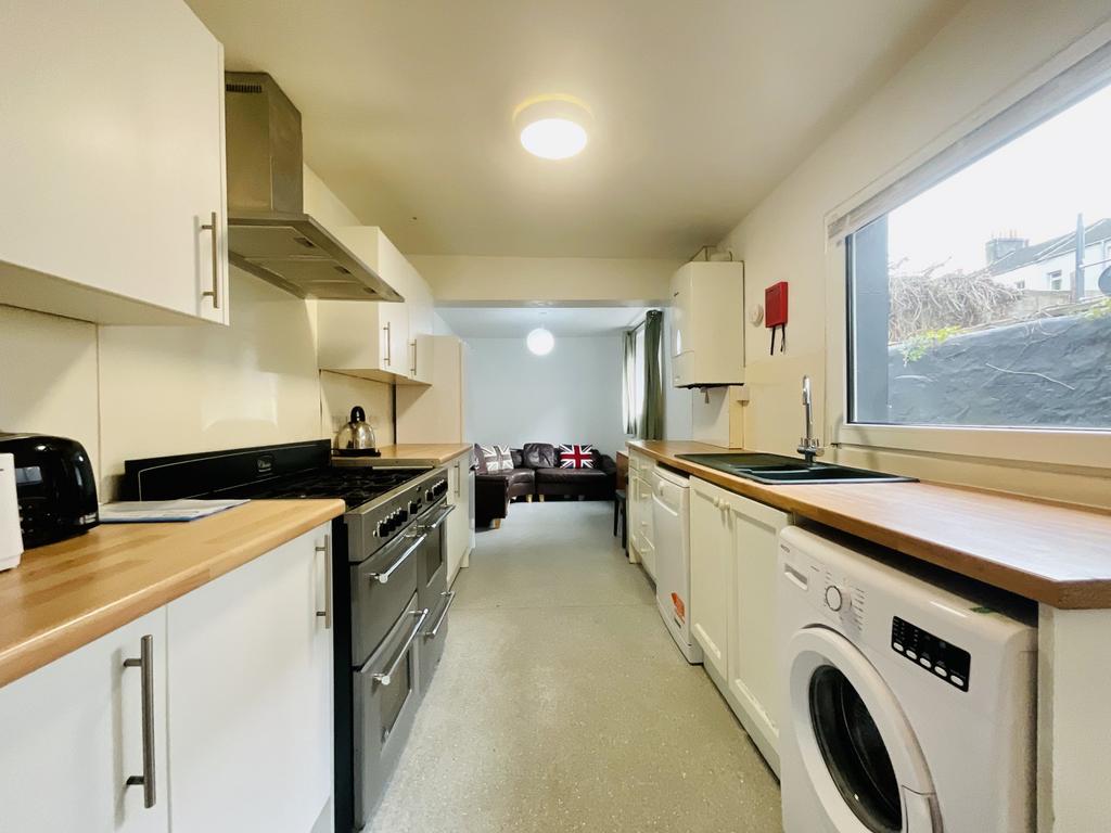 Bright and modern kitchen with ample natural li...