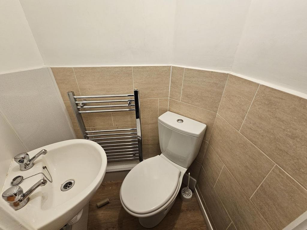 Neat and modern cloakroom with a compact toilet...