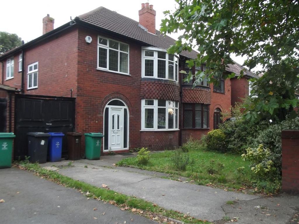 Red-brick semi-detached house with bay windows,...