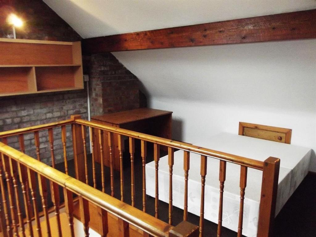 Cozy upstairs double bedroom with exposed woode...